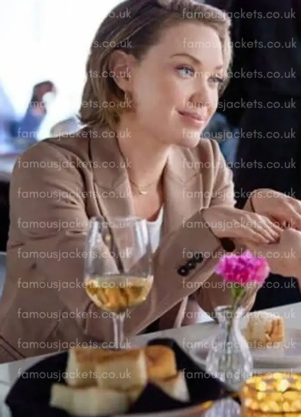 laci-mailey-beige-coat.webp