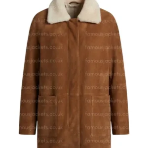 maddie-wilson-brown-coat.webp